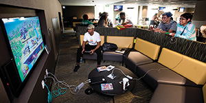Students playing video games in the University Union. (Photo by Gary Payne)