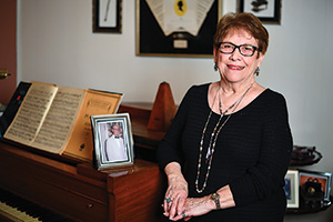 Carol McClendon with a photo of her father, David Singletary (Photo by Michael Clements)