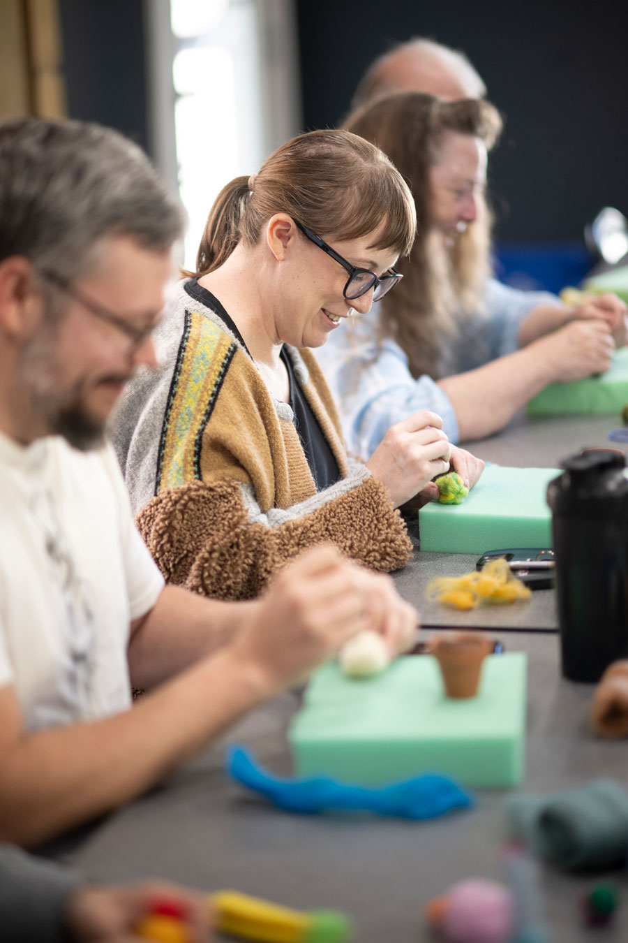 People creating in a group setting at the Denton Maker Center