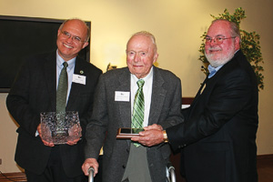 Elmer Kretzschmar (center) with Michael Sayler, associate dean for academic affairs and research in the College of Education (left), and Jerry Thomas, dean of the College of Education (right)