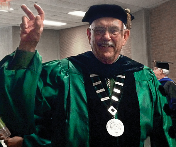 President V. Lane Rawlins speaks at commencement this May. More than 4,000 students earned degrees. UNT graduates more than 8,500 students each year. (Photo by Leslie Wimmer)