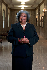 Photo of Burlyce Logan in the hallway of the Hurley Administration Building