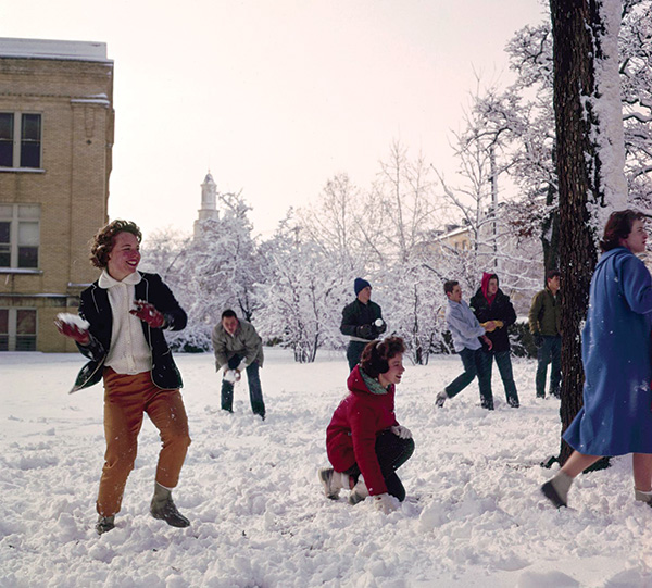 1963 - UNT students having fun at a snowball fight on campus