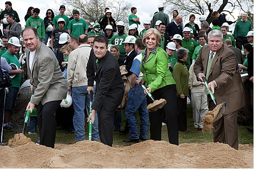 Jordan Case (’81), chair of the volunteer committee raising private donations for the stadium; Dakota Carter, Student Government Association president; UNT President Gretchen M. Bataille and Athletic Director Rick Villarreal turn dirt at the stadium groundbreaking.
