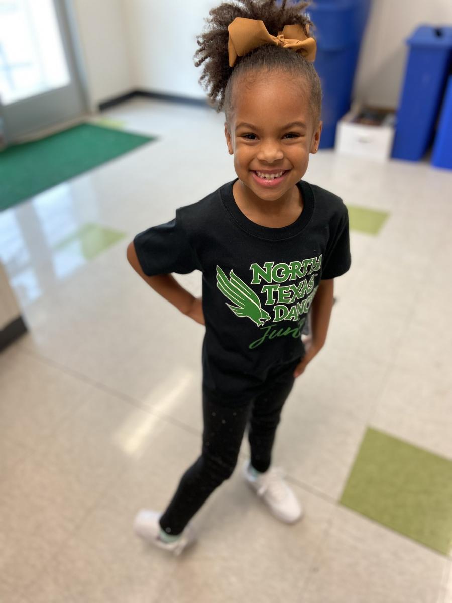 Photo of Morgan McTyre, 5, wearing a black T-shirt with the words “North Texas Dancers Junior” 