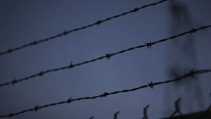 Image from Zephyr, barbed wire fence and a dark sky