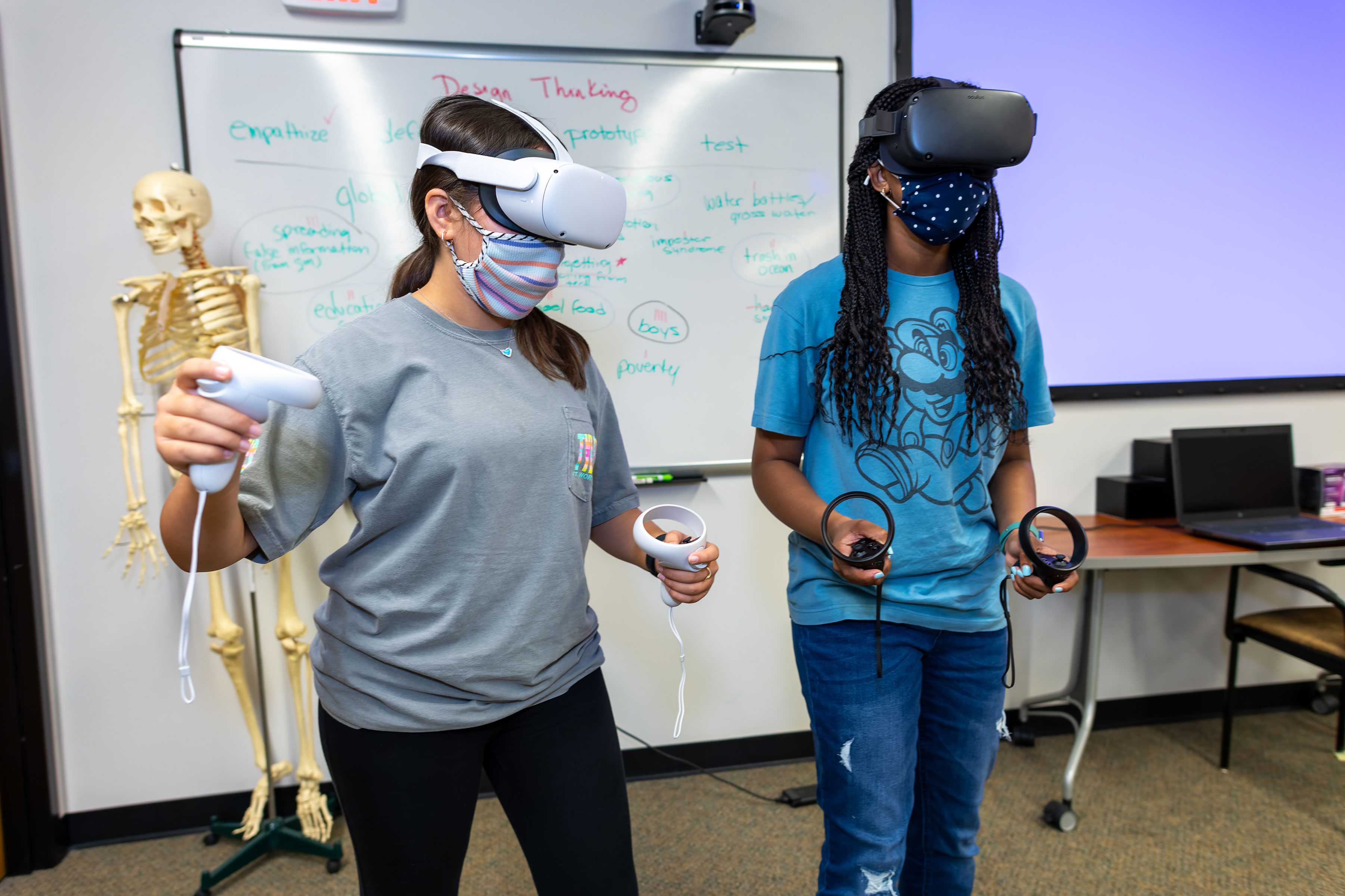 Amelia Rodriguez and Addi Gui, middle school students from Fort Worth, test VR technologies.