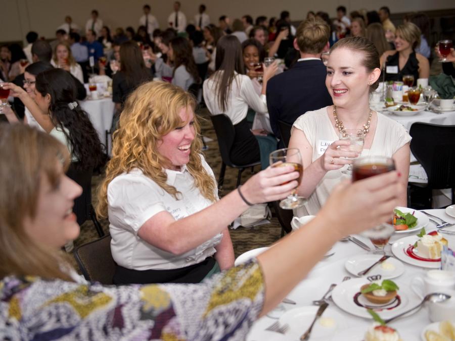 Students toasting at etiquette dinner