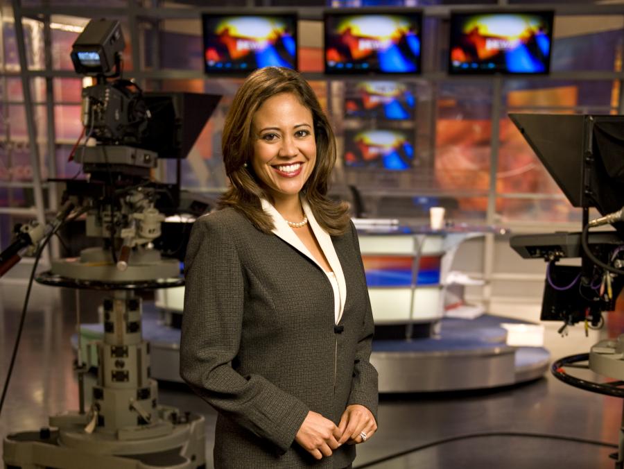 Cynthia Izaguirre standing in news studio
