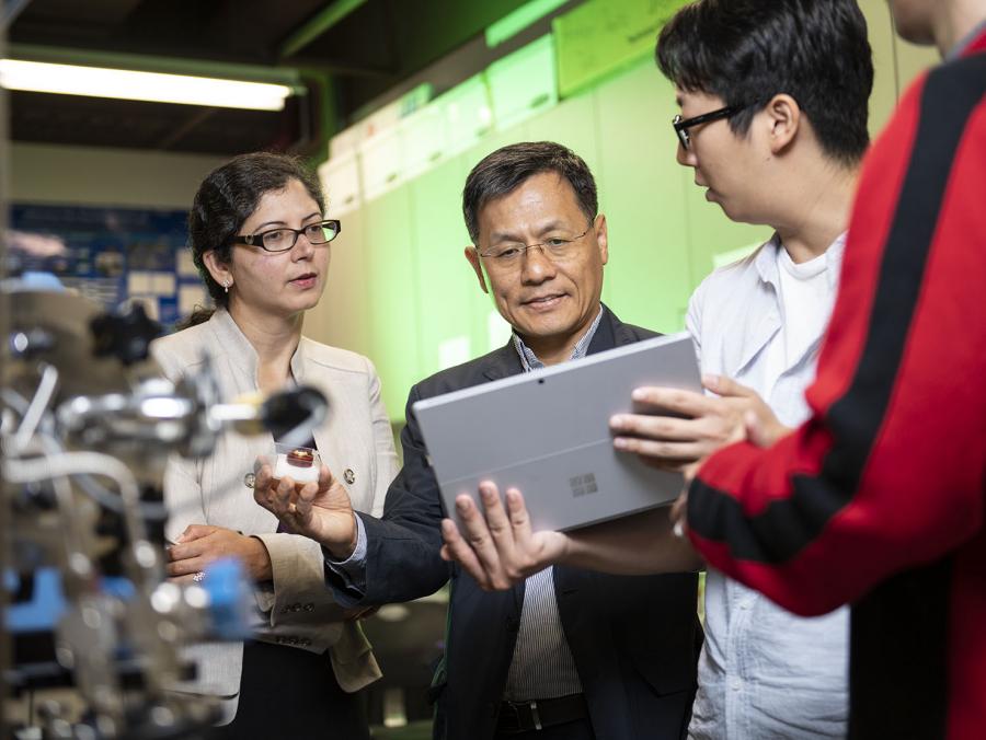 College of Engineering Associate Professor Gayatri Mehta (left) and Professor Wonbong Choi (middle) and discuss potential sensor materials with materials science and engineering graduate student Junyoung Kim (right).