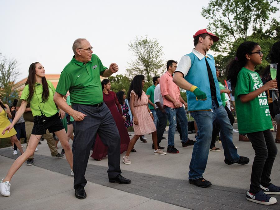 UNT President Neal Smatesk particaptes in a dance at the 2018 Grad Block Party