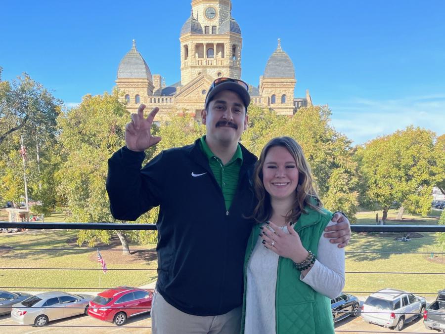 Photo of Jacob Flores and Andrea Plum in front of the Denton County Courthouse