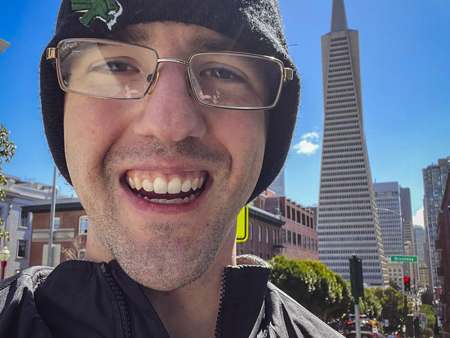Photo of Tim Burke in front of Transamerica Pyramid