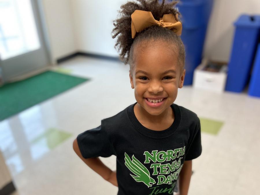 Photo of Morgan McTyre, 5, wearing a black T-shirt with the words “North Texas Dancers Junior” 