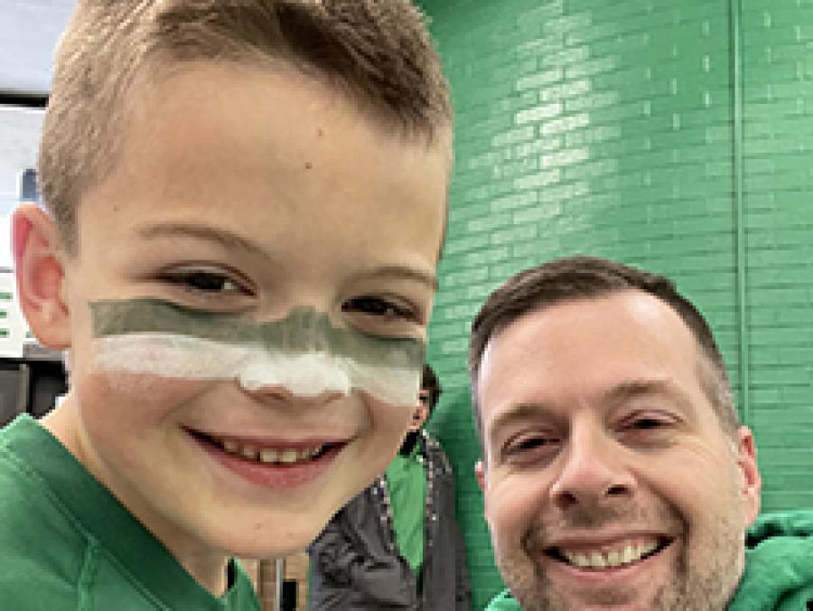 Photo of Steven Pettit and son Cannon in Mean Green gear