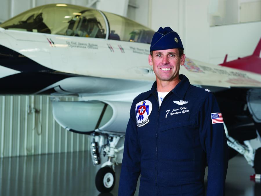 Jason "Buzzer" Koltes standing in front of plane