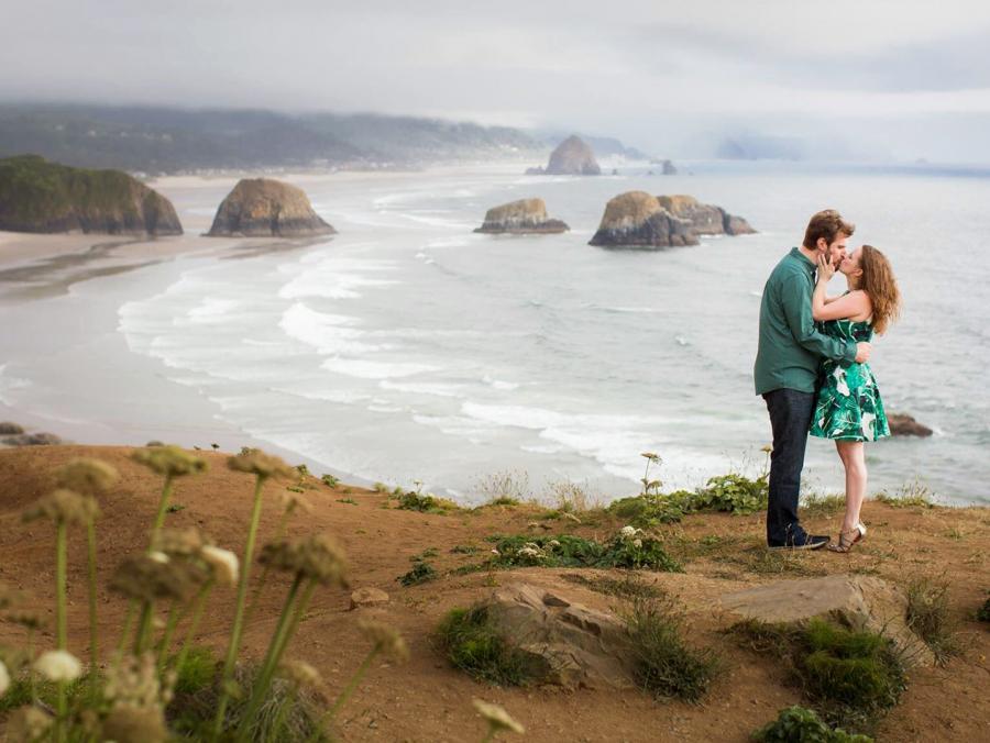 Melissa LeRitz  and Justin Umberson stand kissing at seashore