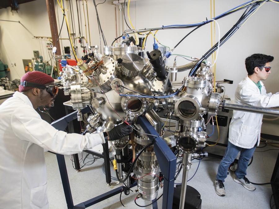 Two students perform semiconductor-related research at UNT's Discovery Park.