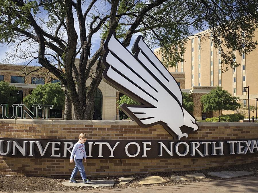 Thomas walking at the UNT campus