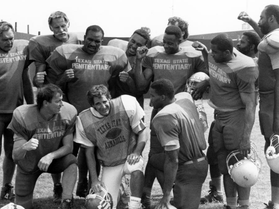Scott Bakula with 'Texas Penitentiary Team' athletes filming Necessary Roughness in 1991