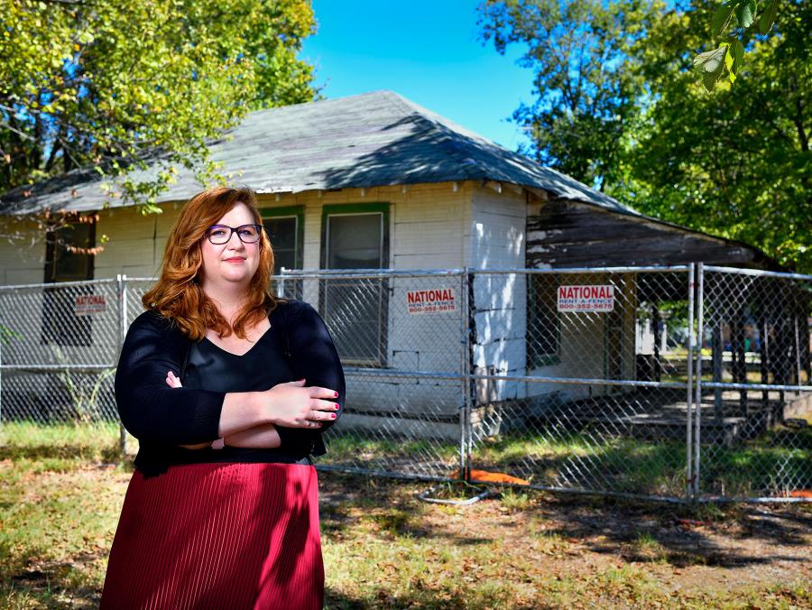 Micah Crittenden stands in front of the Burks Street house that used to be a one-room schoolhouse in Oakdale.