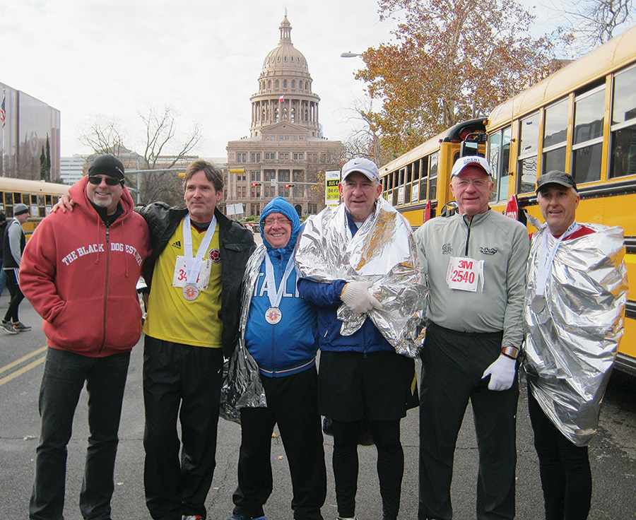 Posing after the race are, from left, Pat Curry ('77), Steve McGregor ('74), Paul Hoffmann ('75, '78 M.S.), Richard Pettigrew ('76), Coach John McKenzie and Ronnie Hess ('77).